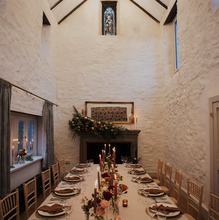 A picture of a wedding table within Craigard's chapel, as part of a new exclusive package. There is text over the picture: "The luxury Intimate Wedding Venue".